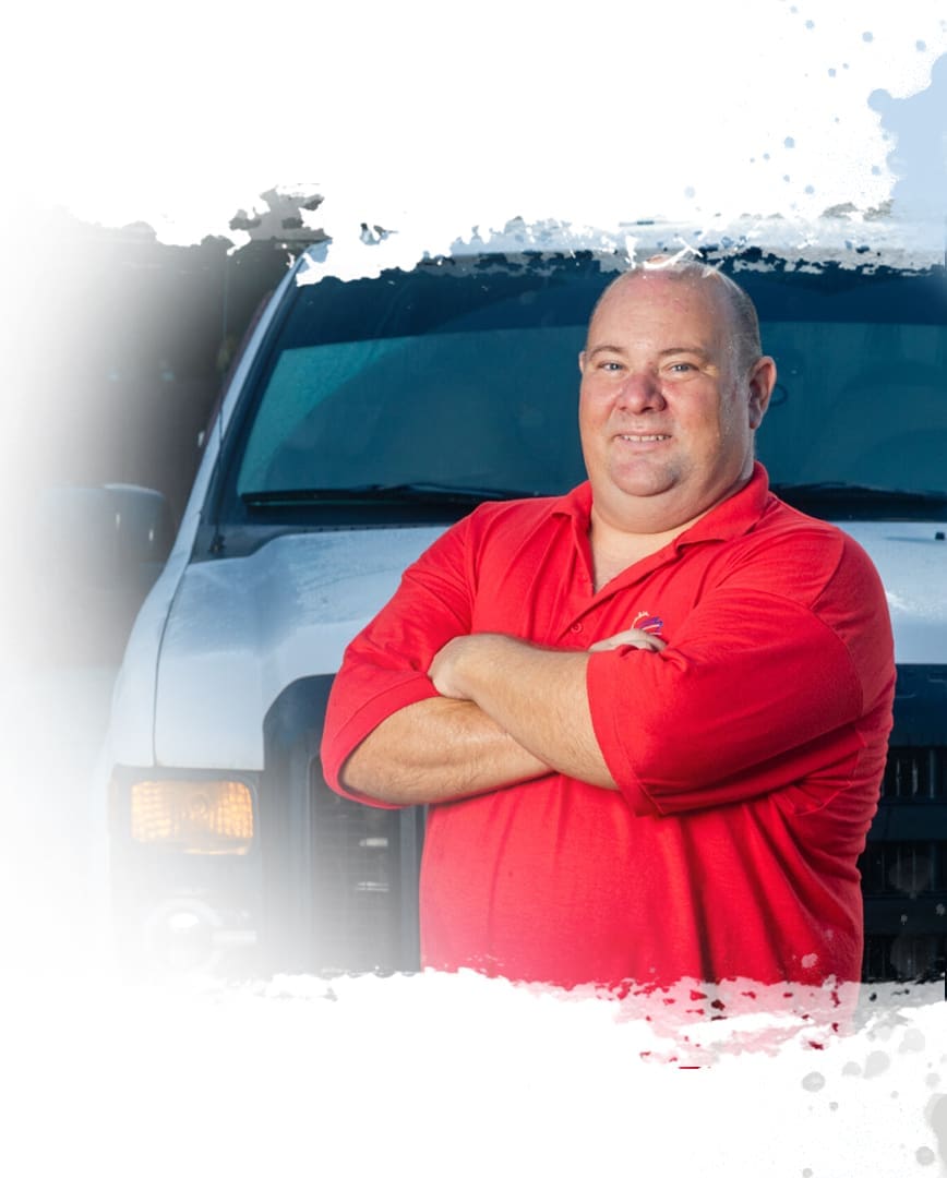 A man standing in front of a truck