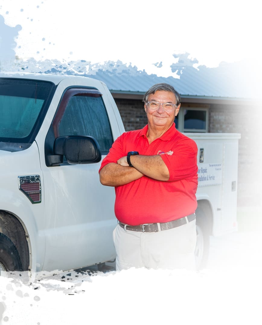 A man standing in front of a white truck.